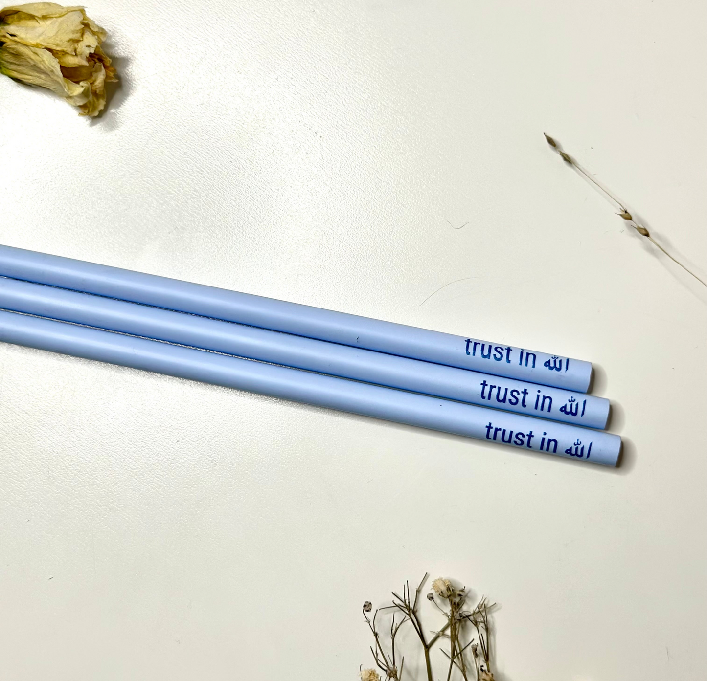 pencil pastel blue “trust in Allah”