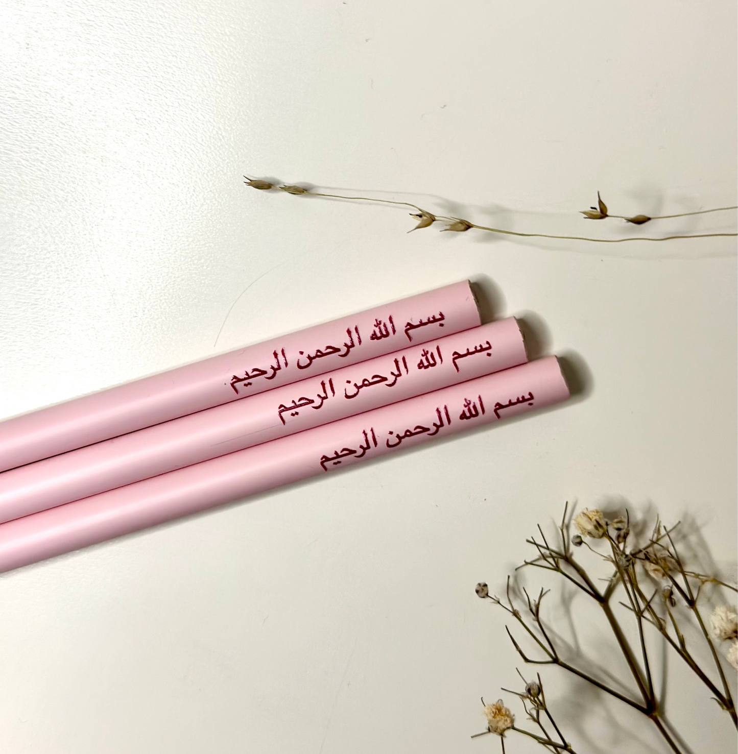 Pencil in pastel pink with the Basmala